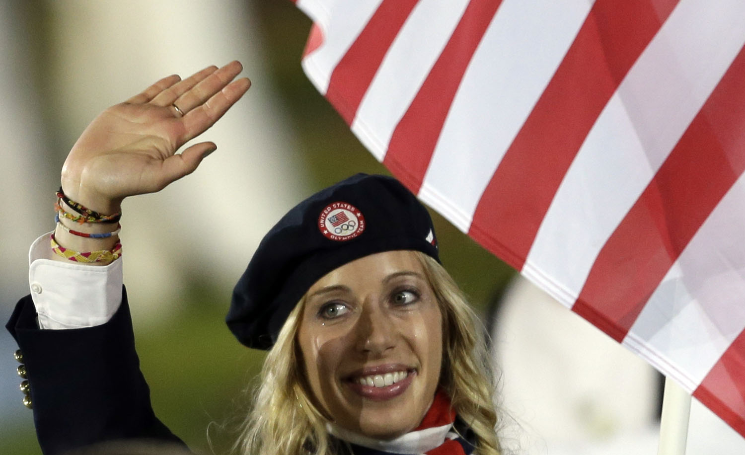 United States's fencer Mariel Zagunis carries the flag during the Opening Ceremony at the 2012 Summer Olympics, Friday, July 27, 2012, in London.