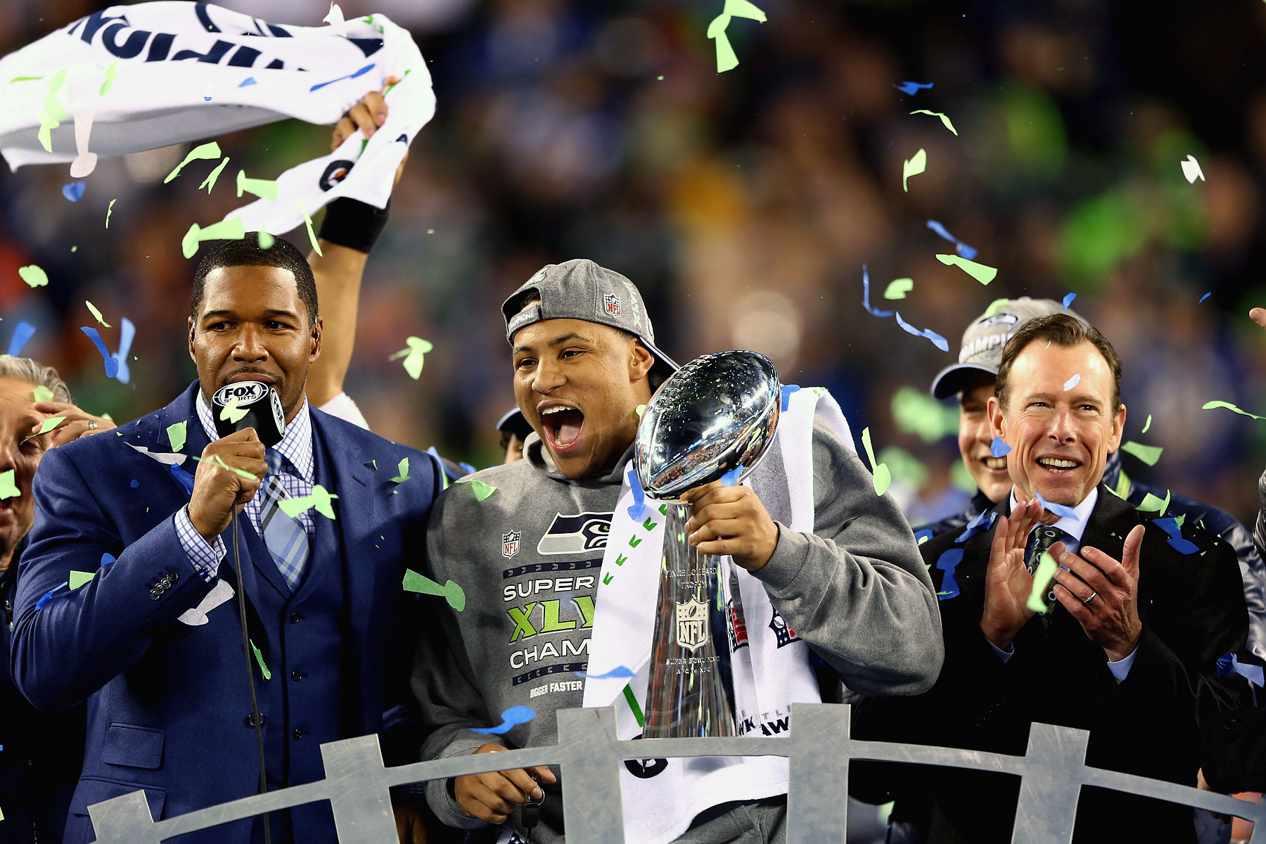 Outside linebacker and Super Bowl MVP Malcolm Smith of the Seattle Seahawks holds the Vince Lombardi Trophy after winning Super Bowl XLVIII.