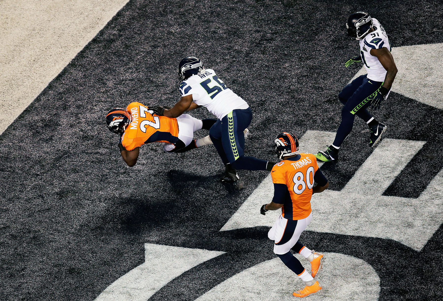 Running back Knowshon Moreno of the Denver Broncos recovers the ball in the endzone for a safety against the Seattle Seahawks during the first quarter.