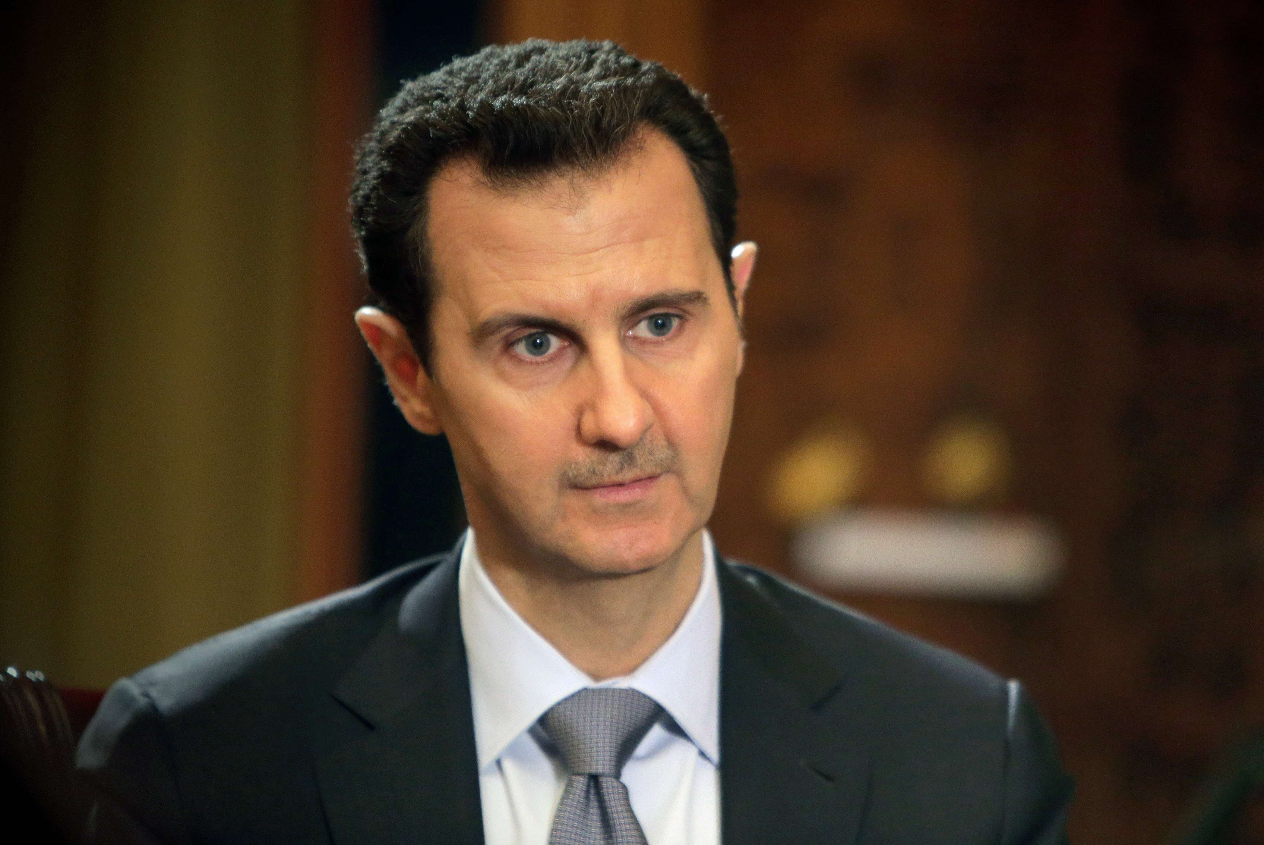 Syrian President Bashar al-Assad during an interview with AFP in at the presidential palace in Damascus, in a photo released on Jan. 20, 2014. (Joseph Eid / AFP / Getty Images)