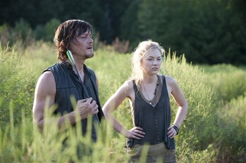 Daryl Dixon (Norman Reedus) and Beth Greene (Emily Kinney) in AMC's The Walking Dead.