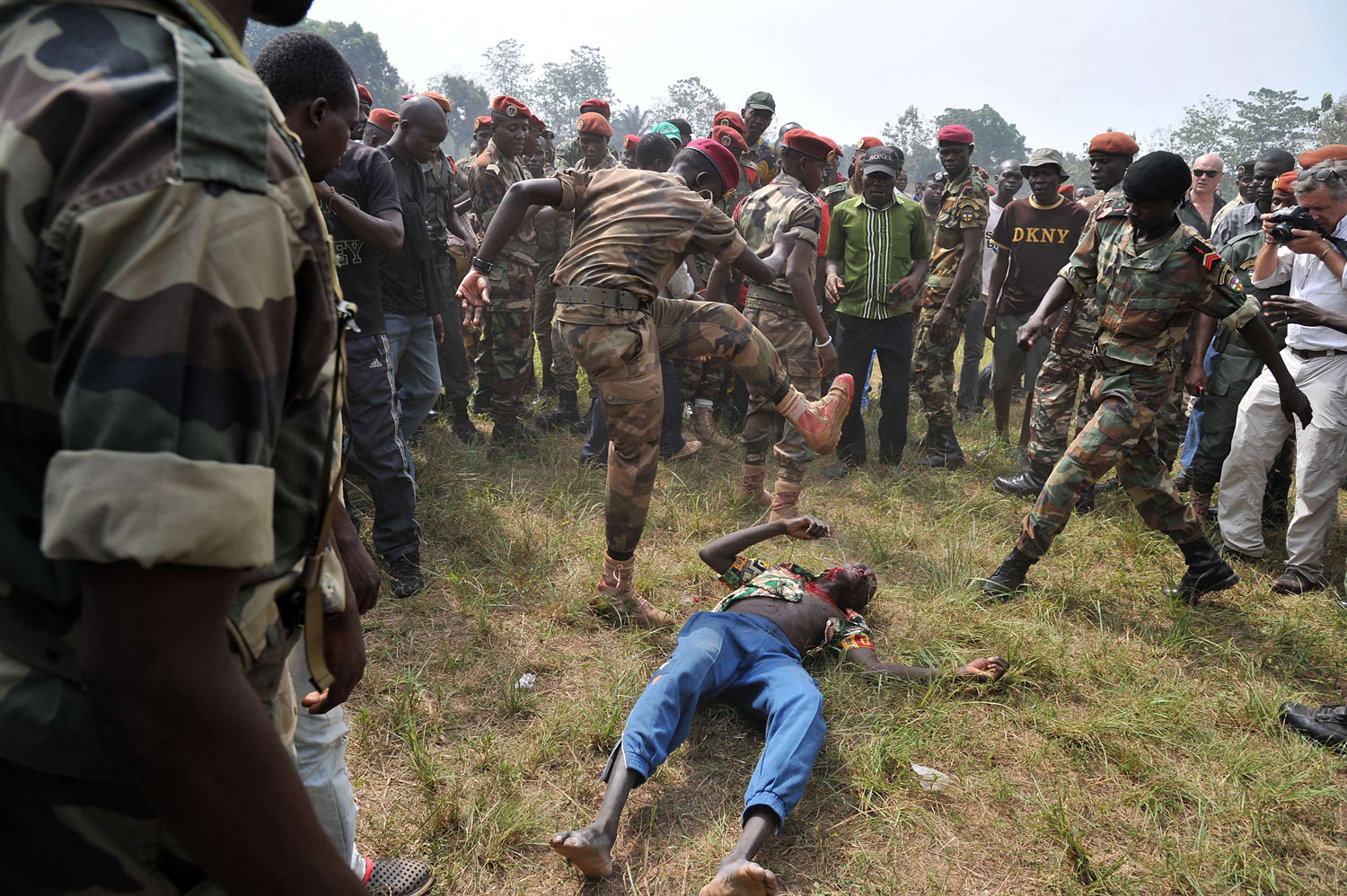 Members of the Central African Armed Forces lynch a man suspected of being a former Seleka rebel on Feb. 5, 2014, in Bangui.