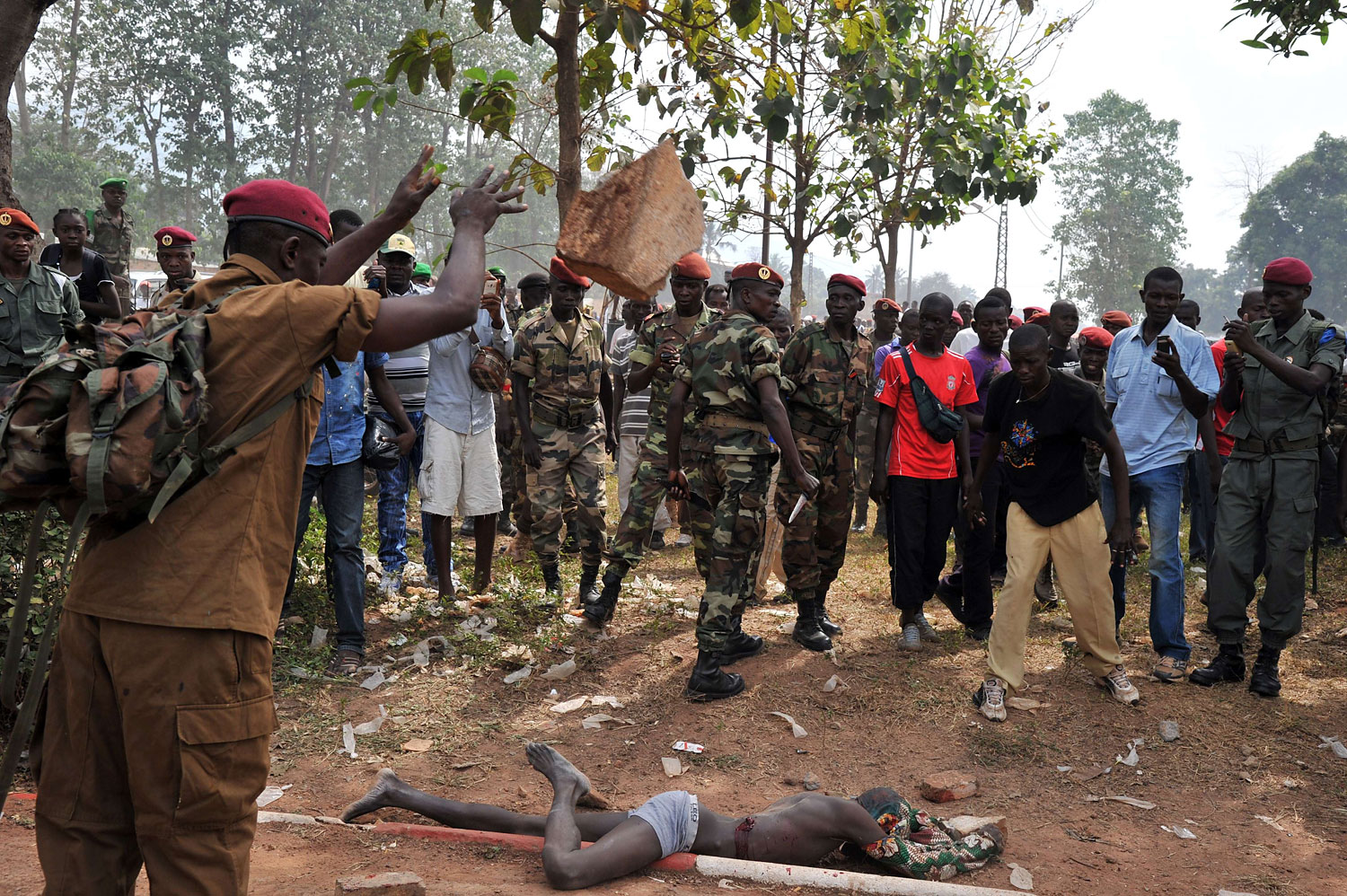 Members of the Central African Armed Forces lynch a man suspected of being a former Seleka rebel on Feb. 5, 2014, in Bangui.