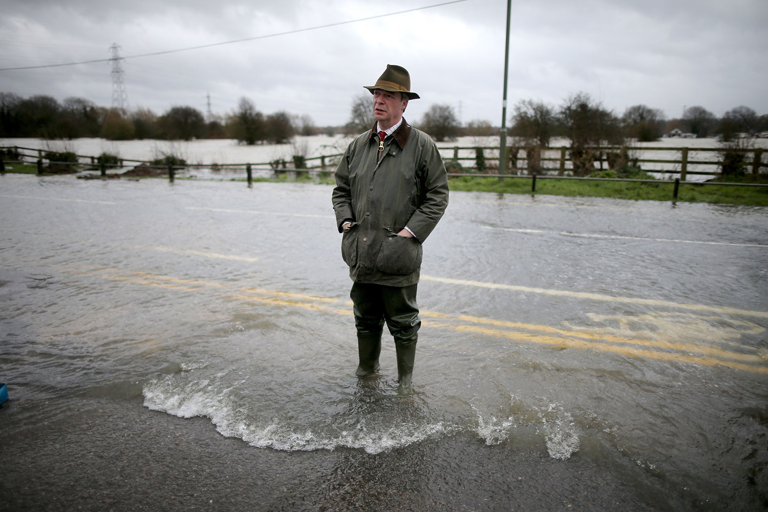 Leader of UKIP Nigel Farage tours flooded properties  and roads as he visits Chertsey on Feb. 11, 2014 in Chertsey, United Kingdom. 