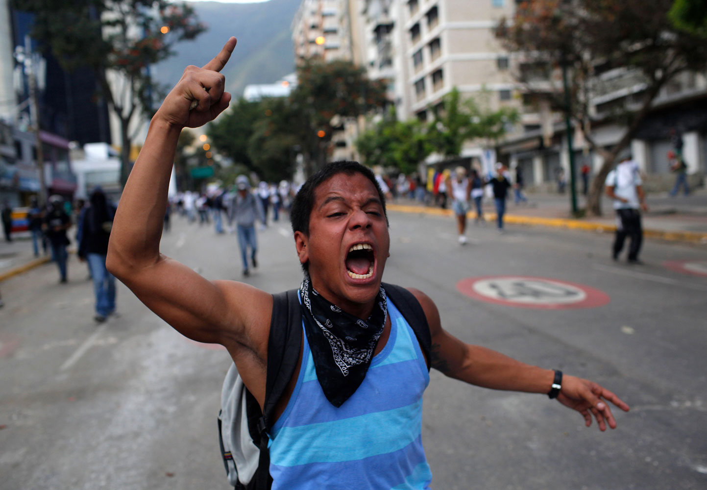 A demonstrator shouts slogans against Bolivarian National Guards during clashes in Caracas, March 2, 2014.