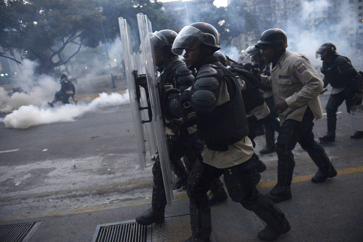 Riot police clash with opponents of Venezuelan President Nicolas Maduro during an anti-government protest in Caracas on Feb. 27, 2014.
