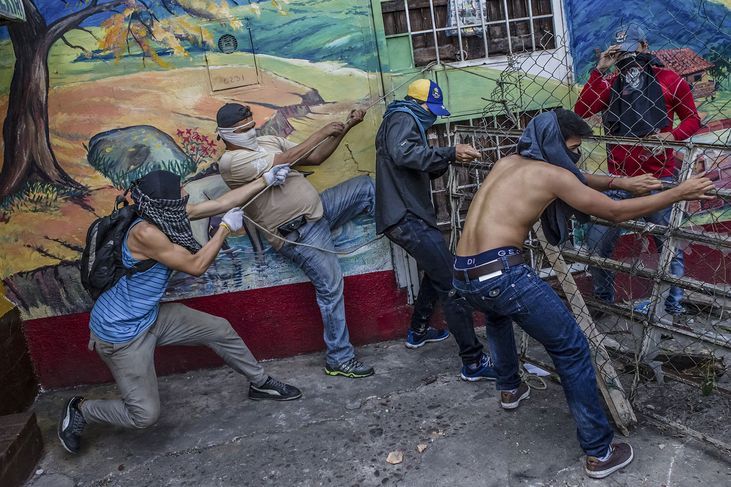 Protesters build a barrier in the Las Pilas area of San Cristobal, Feb. 24, 2014. The capital of Tachira State, bordering Colombia, is the site of the some of the fiercest protests against the government of President Nicolas Maduro.