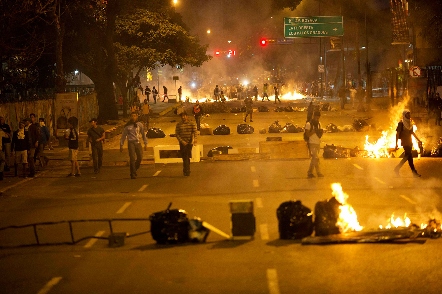 Objects placed by opposition protesters block a road in the Altamira neighborhood of Caracas, Feb. 20, 2014.