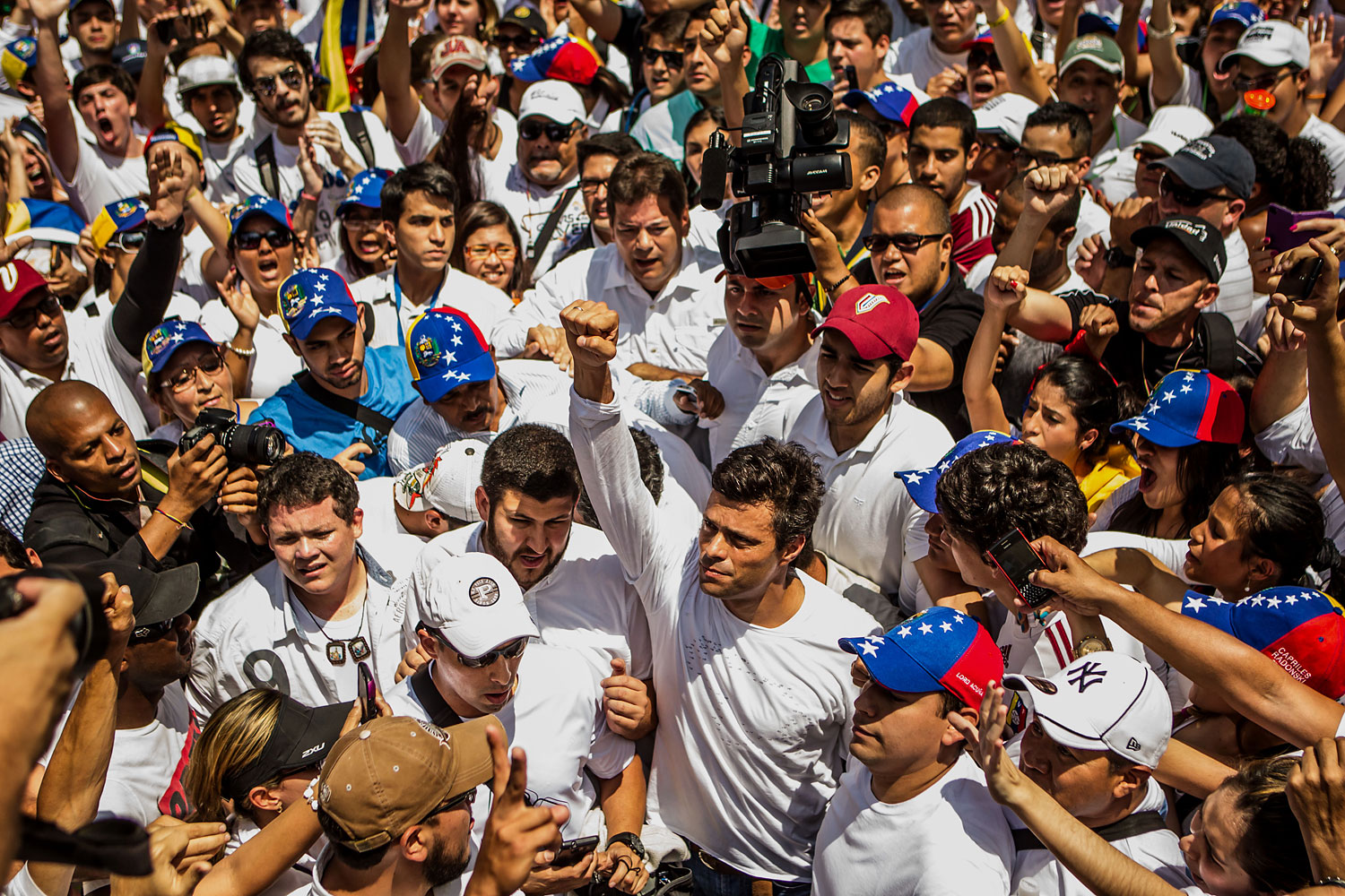 Opposition leader Leopoldo López arrives to the march in a swarm of supporters, Feb. 18, 2014. Thousands of people took to the streets today to support López as he surrendered to police during a peaceful march in Caracas.