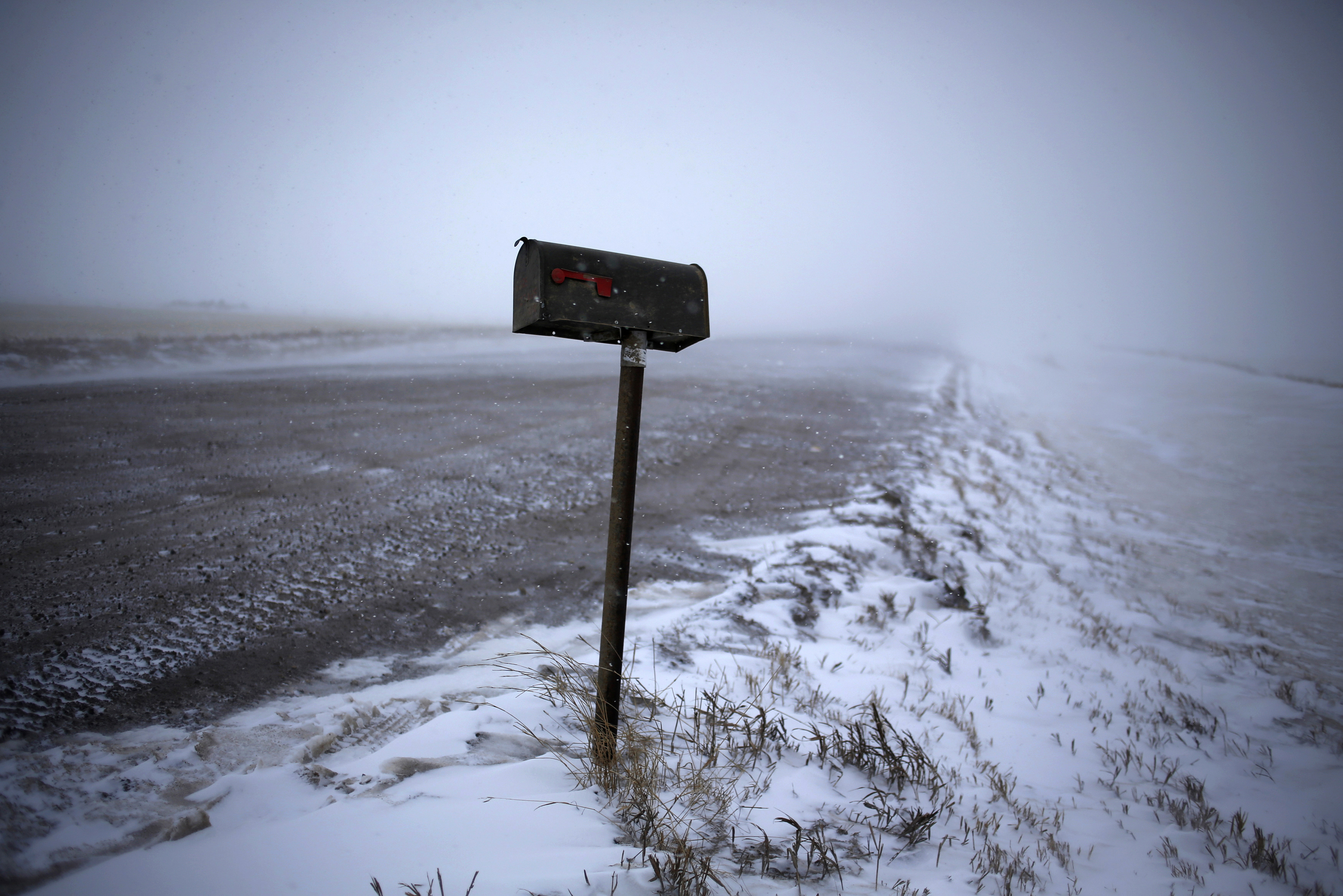 A mailbox is seen along a road during a snowstorm outside of Williston, North Dakota March 11, 2013.
