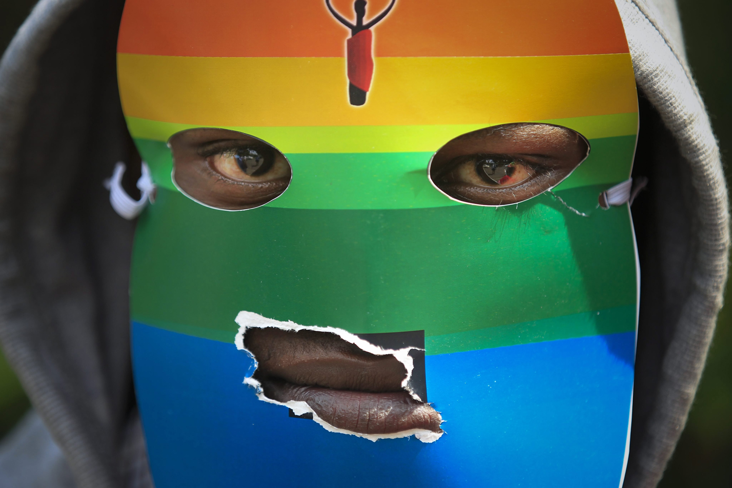 Feb. 10, 2014. A masked Kenyan supporter of the LGBT community joins others during a protest against Uganda's anti-gay bill in front of the Ugandan High Commission in Nairobi, Kenya.