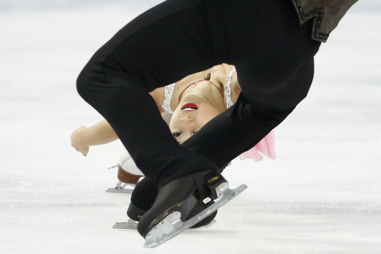 Zhang and Bartholomay of the U.S. during pairs short program at the Sochi 2014 Winter Olympics