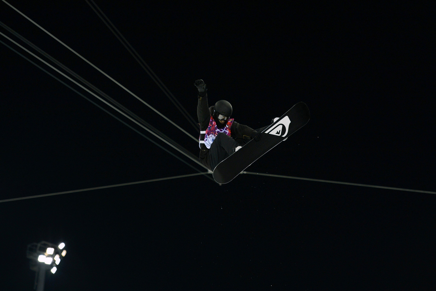Podladtchikov performs a jump during the men's snowboard halfpipe semi-final event at the 2014 Sochi Winter Olympic Games