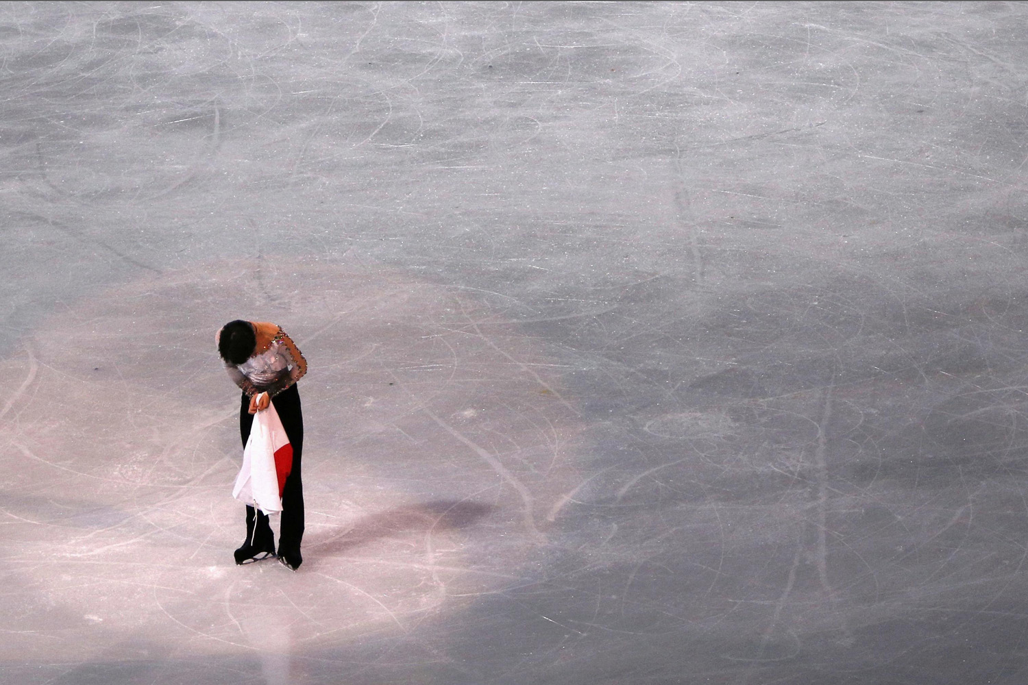 Yuzuru Hanyu bows after men's free skating program at the Sochi 2014 Winter Olympics