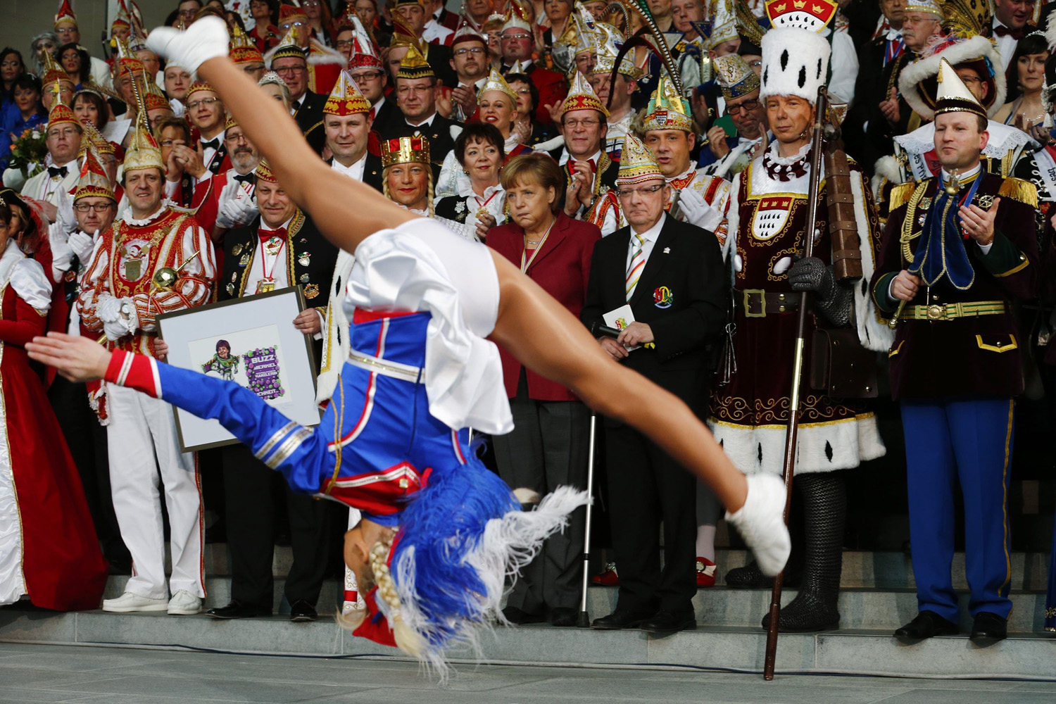 German Chancellor Merkel watches a dance performance during a reception of German carnival societies in Berlin