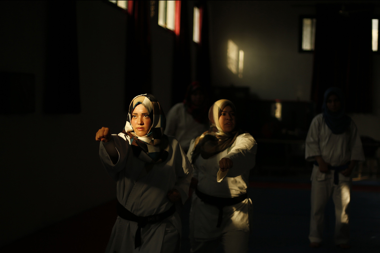 Palestinian girls take part in a karate class at al-Reyadi club in Gaza City