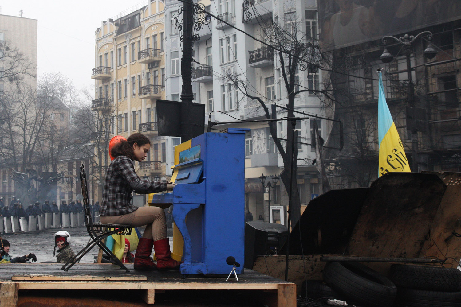 Feb. 10, 2014. A girl plays the piano on the barricades on Grushevskogo Street, Kiev, Ukraine.