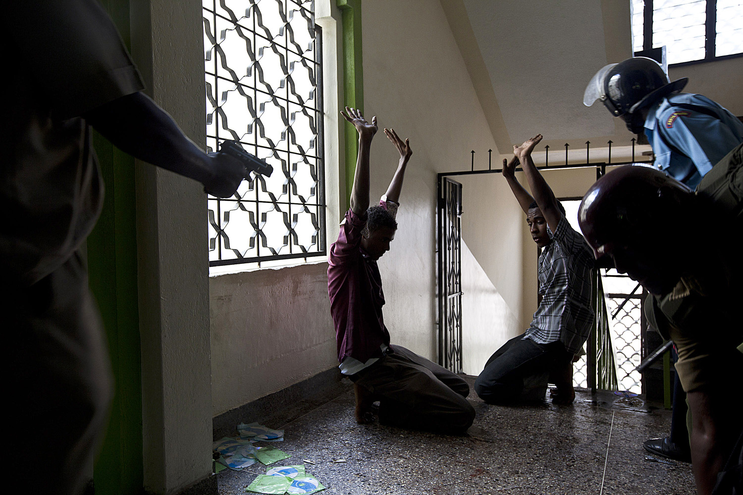 Feb. 2, 2014. Alleged jihadist youths are apprehended by police during a raid inside the Masjid Mussa mosque in the Majengo area of Mombasa, Kenya.