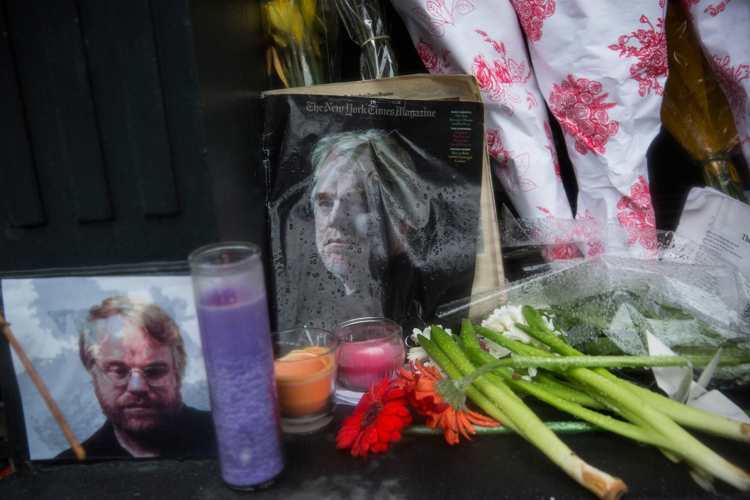 Feb. 3, 2014. A vigil of candles, flowers and portraits sits outside the apartment of actor Phillip Seymour Hoffman in the West Village neighborhood of New York City.