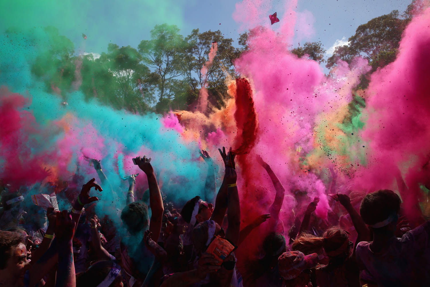 Feb. 9, 2014. Competitors listen to a DJ set and throw packets of colored powder after finishing the Color Run at Sydney Olympic Park in Sydney, Australia.
