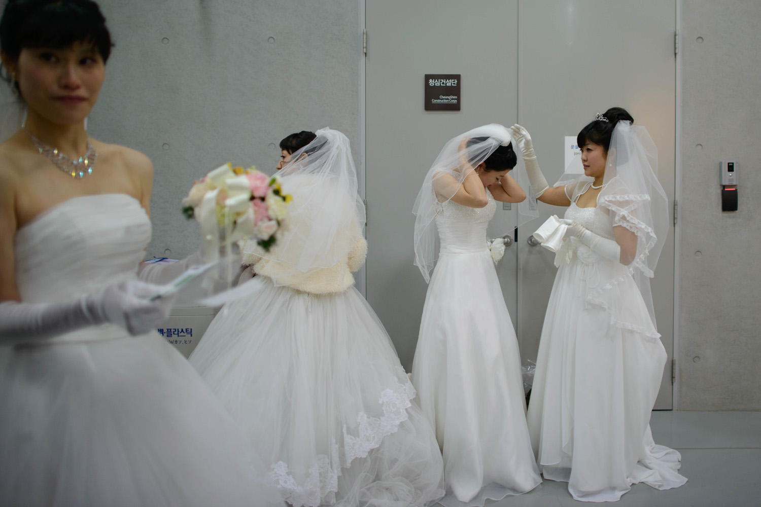 Feb. 12, 2014. Brides prepare for a mass wedding at an event held by the Unification Church in Gapyeong, South Korea.