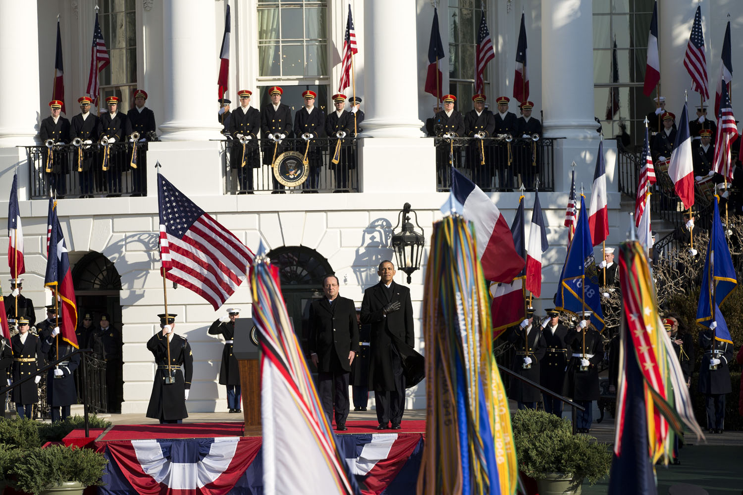 Feb. 11, 2014. President Barack Obama and French President François Hollande stand for the national anthem during a state arrival ceremony on the South Lawn of the White House in Washington.