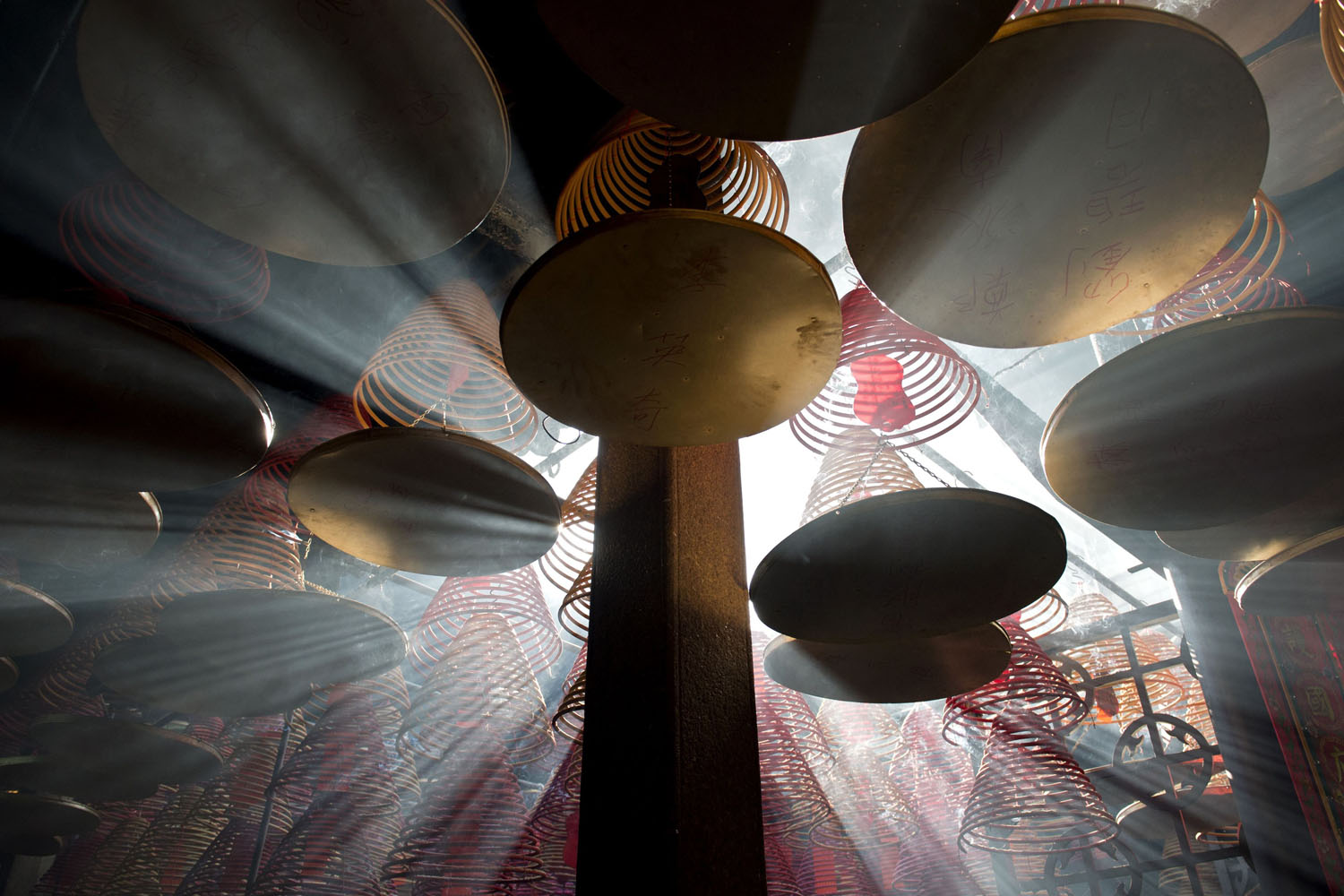 Feb. 3, 2014. Sunlight shines through hanging incense coils at the Tin Hau Temple in the Yau Ma Tei area of Hong Kong on the fourth day of the Lunar New Year holiday.