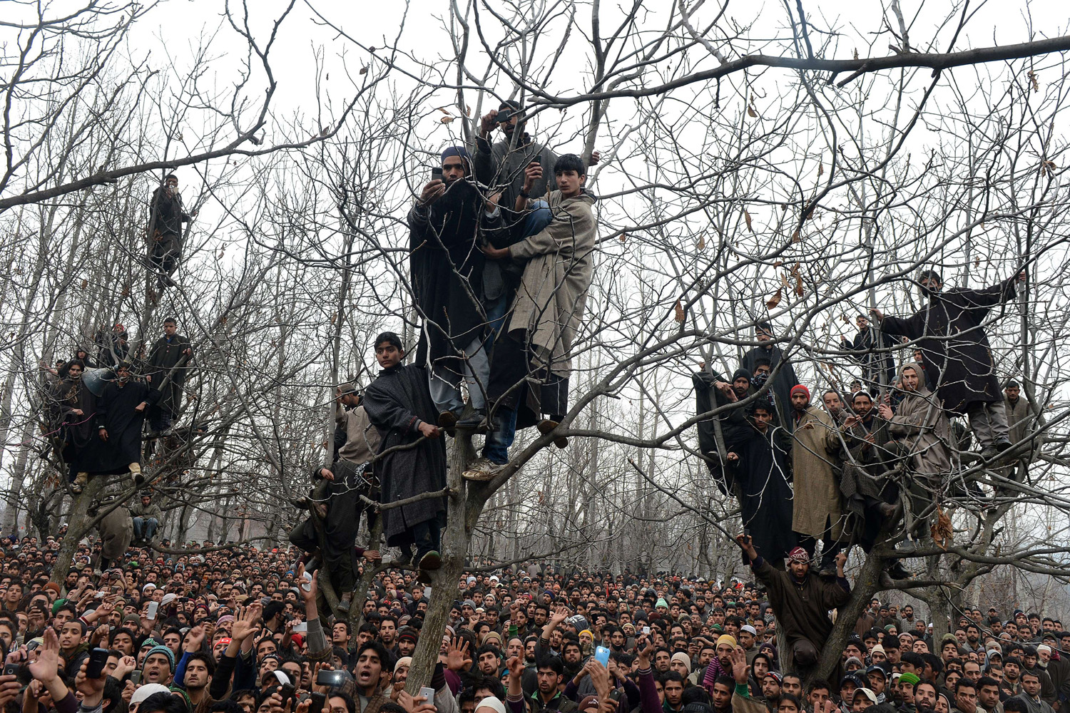 Feb. 14, 2014. Kashmiri villagers shout pro-freedom slogans during the funeral of alleged Hizbul Mujahideen militant Arshid Ahmed in Shopian, some 60 kms south of Srinagar, Kashmir.