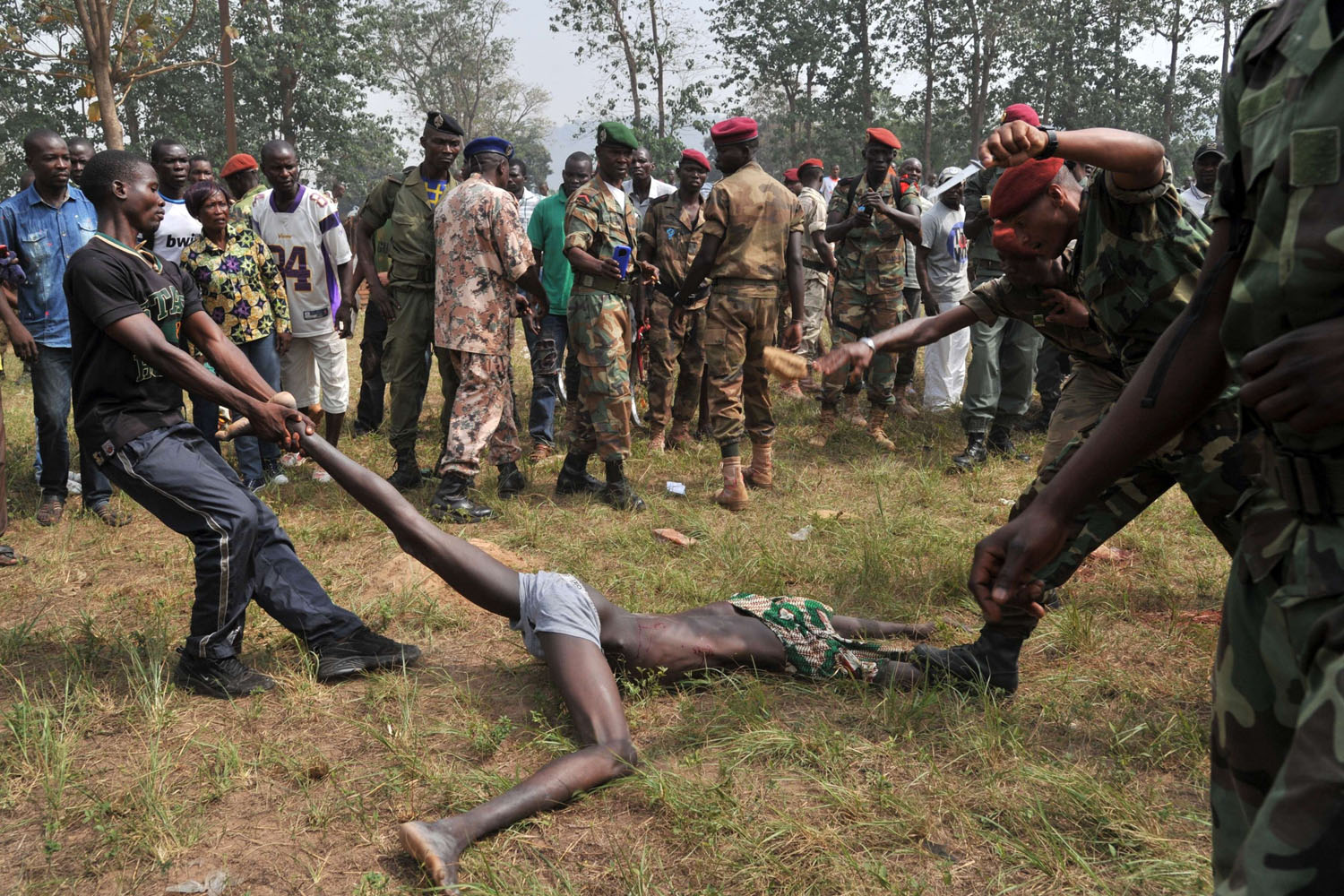 Feb. 5, 2014. Members of the Central African Armed Forces (FACA) lynch a man suspected of being a former Séléka rebel in Bangui, Central African Republic.
