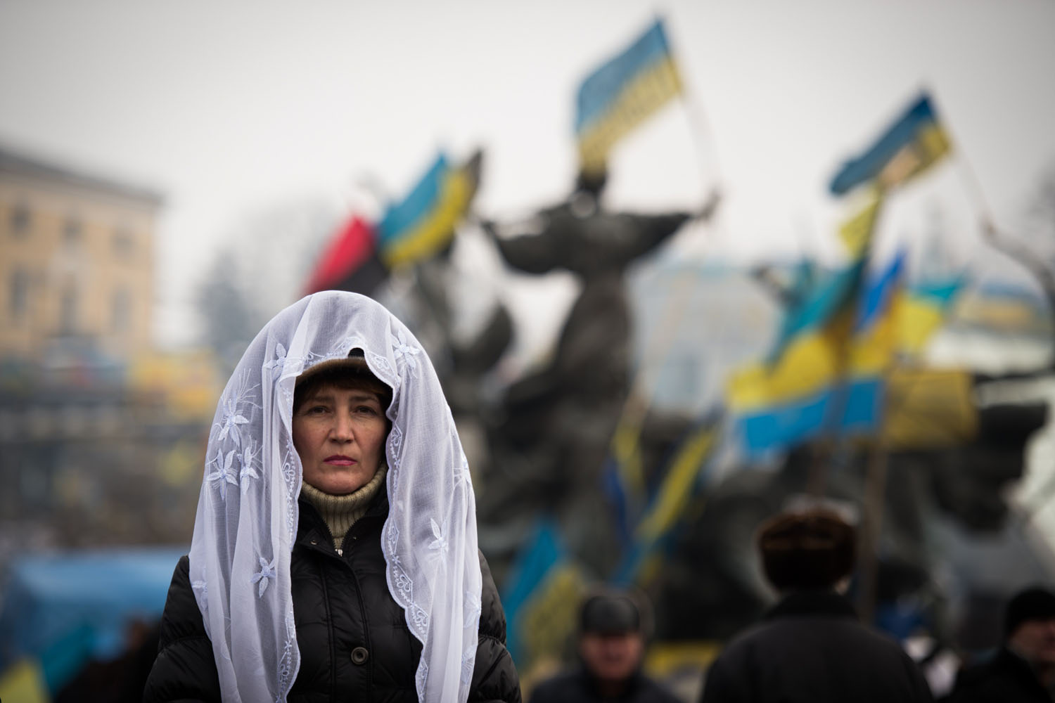 Feb. 9, 2014. A woman attends a mass rally of the opposition on Independence Square in Kiev.