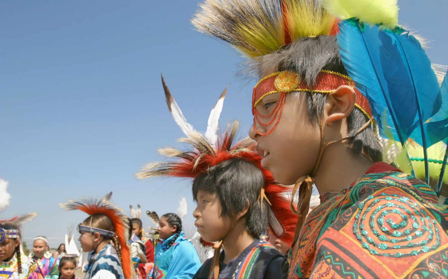 Young men wait to take part in an annual pow wow and rodeo in Toppenish, Wash. The boys are members of the Coleville and Yakama tribes.