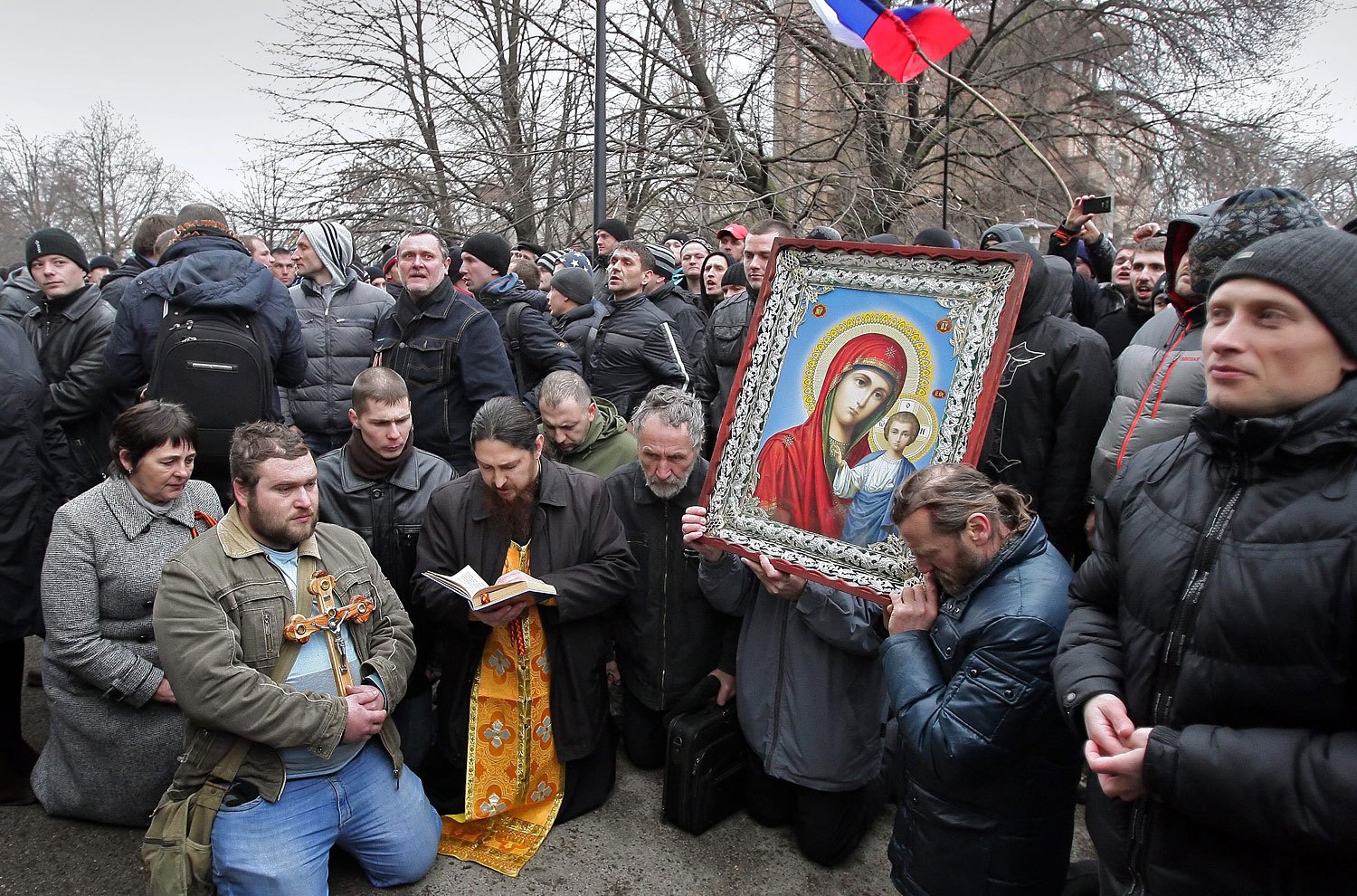 Pro-Russian activists pray near the Crimean Parliament building in Simferopol, Feb. 26, 2014.