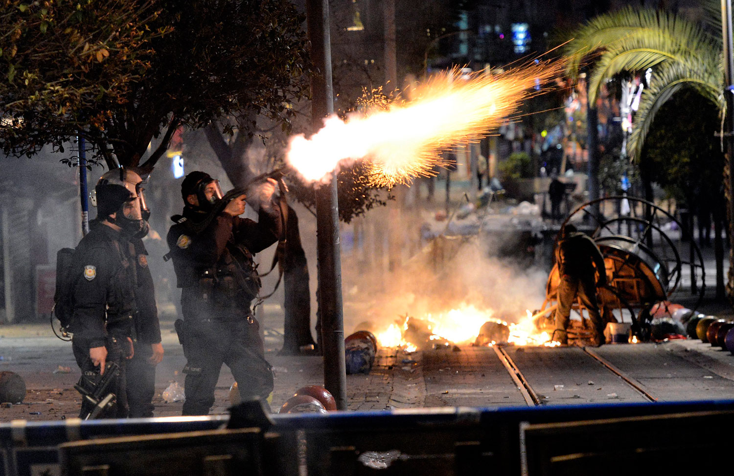 Turkish riot police fires tear gas to disperse protesters during a demonstration in Istanbul, March 11, 2014.
