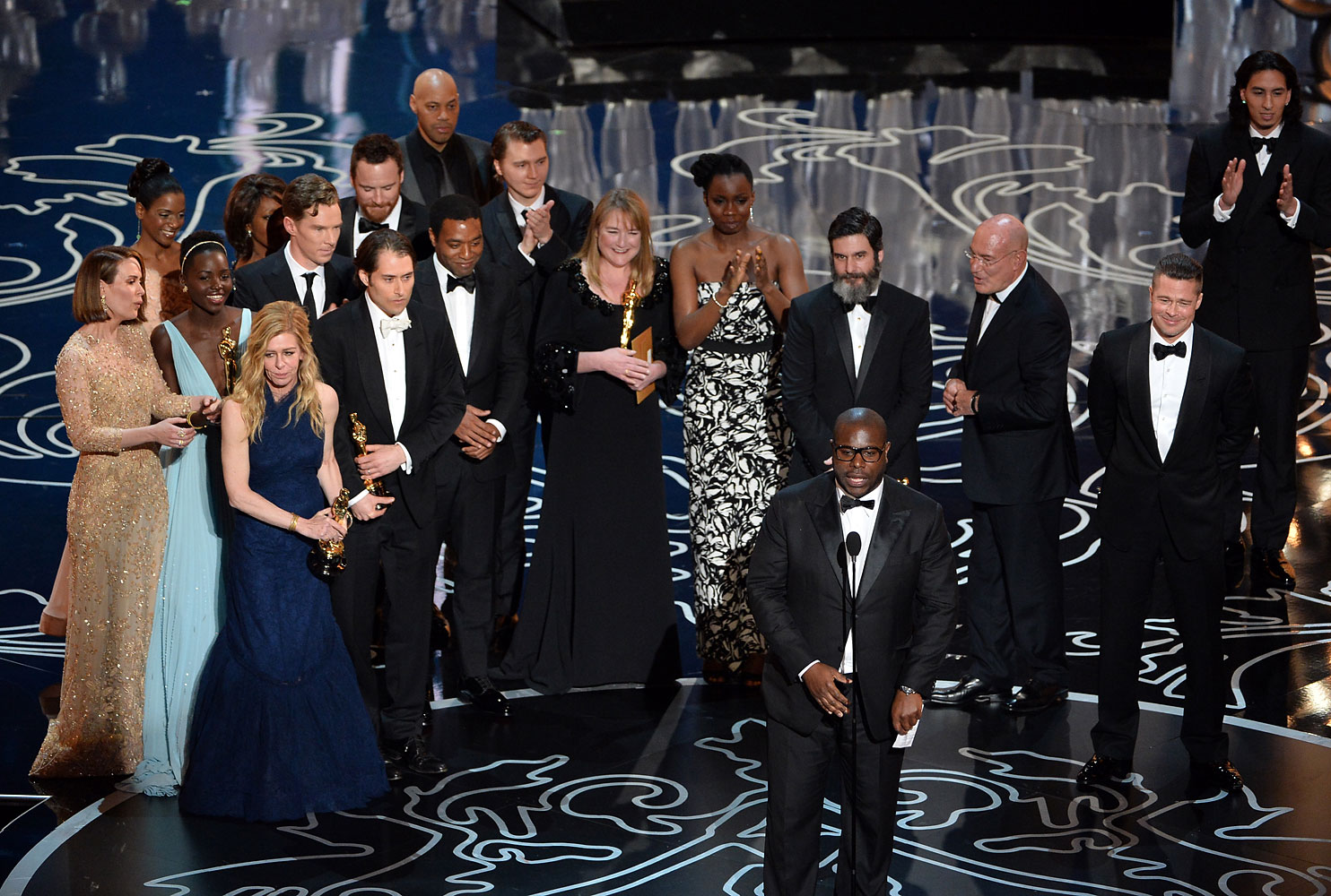 Director Steve McQueen (C) accepts the Best Picture award for '12 Years a Slave' onstage during the Oscars at the Dolby Theatre on March 2, 2014 in Hollywood, California.