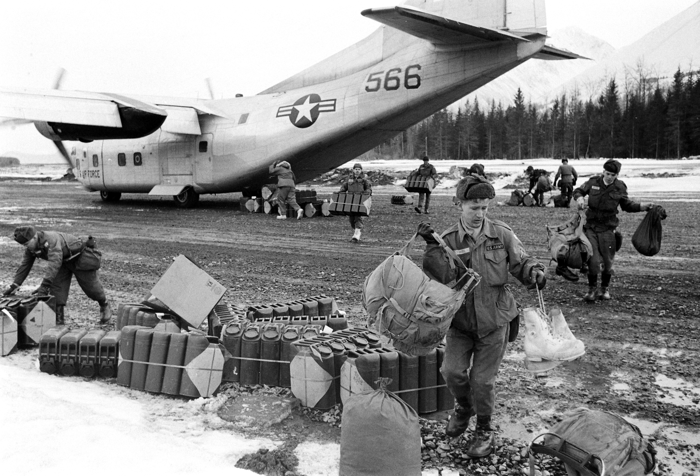 Unloading relief supplies after the March 1964 Good Friday Earthquake, Alaska.