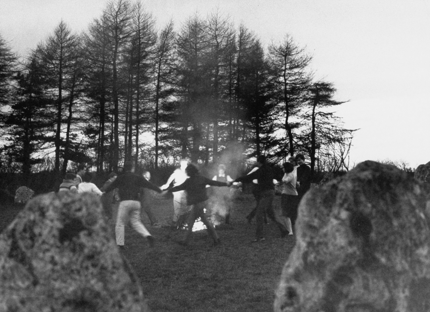 In a thousand-year-old rite, the witches dance around bonfire within prehistoric Rollright stone circle that stands in Oxfordshire.
