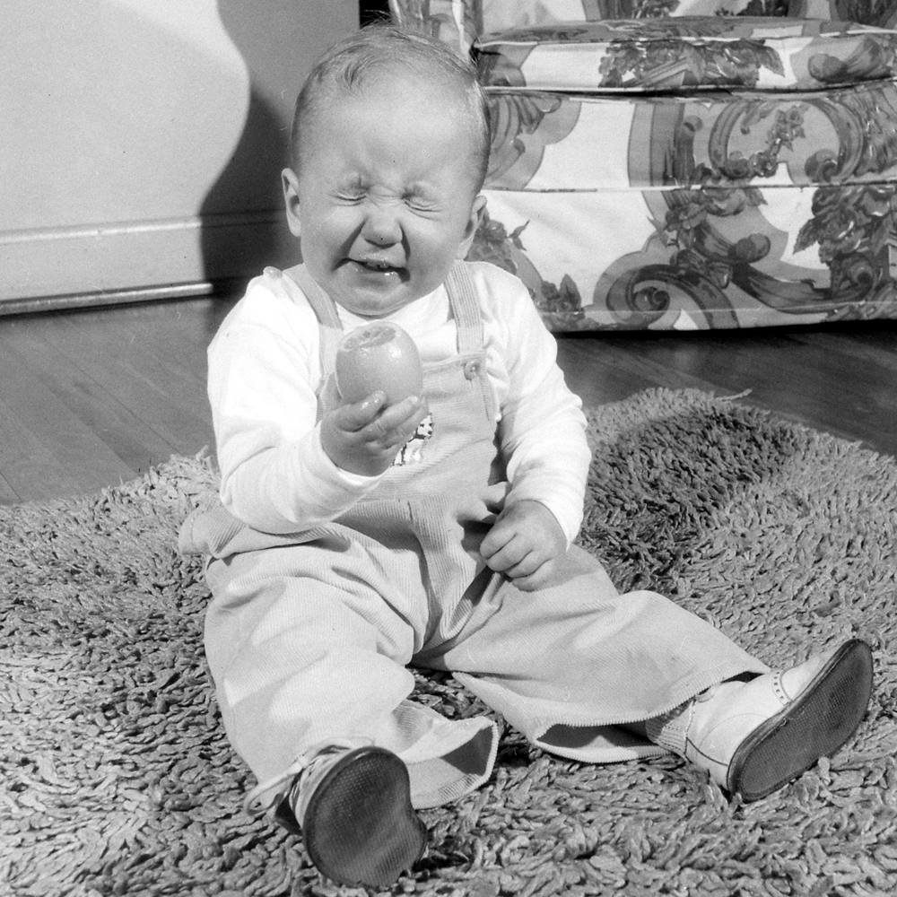 Eleven-month-old Michael Thomas Roesle reacts to a bite of his favorite food: a lemon.