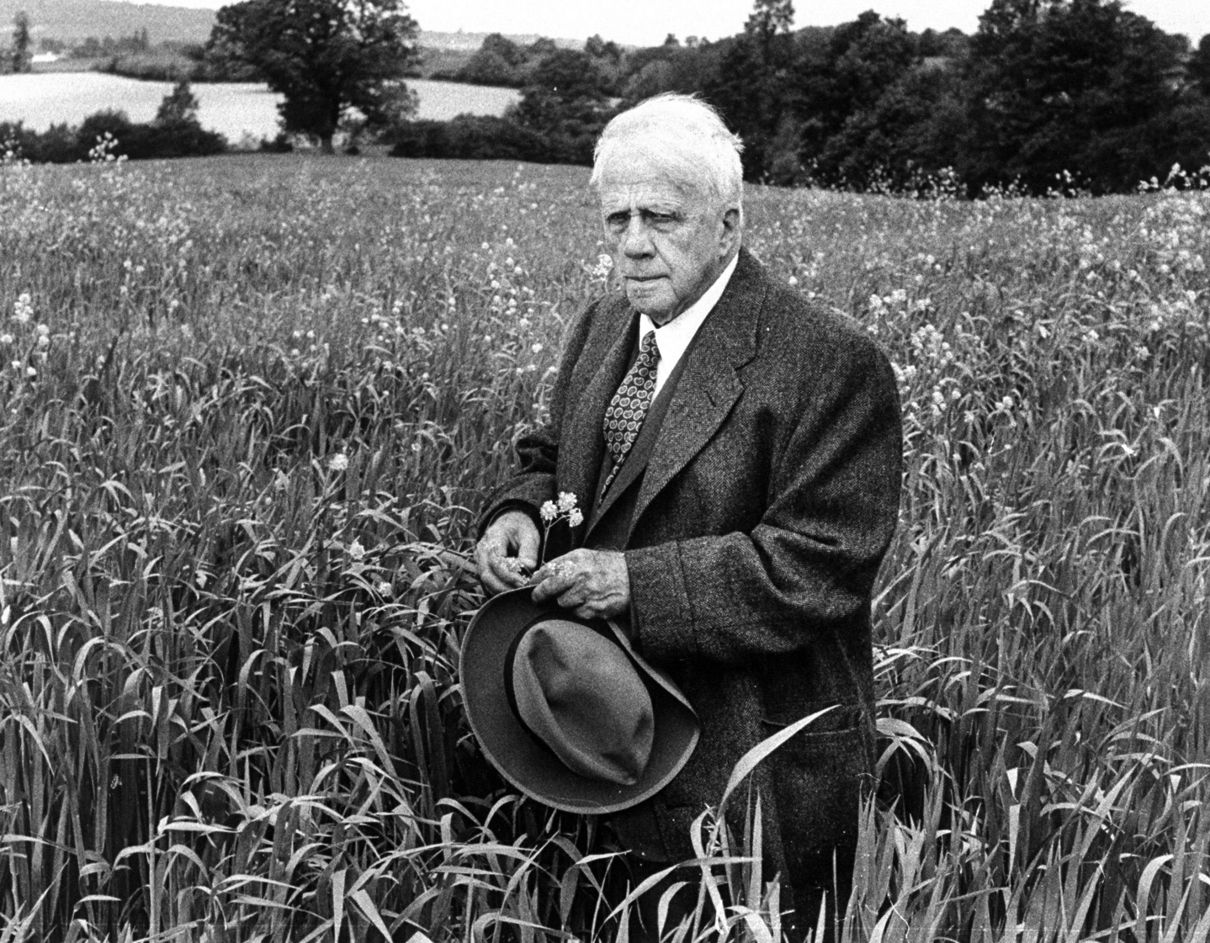 Robert Frost in an English meadow, 1957.