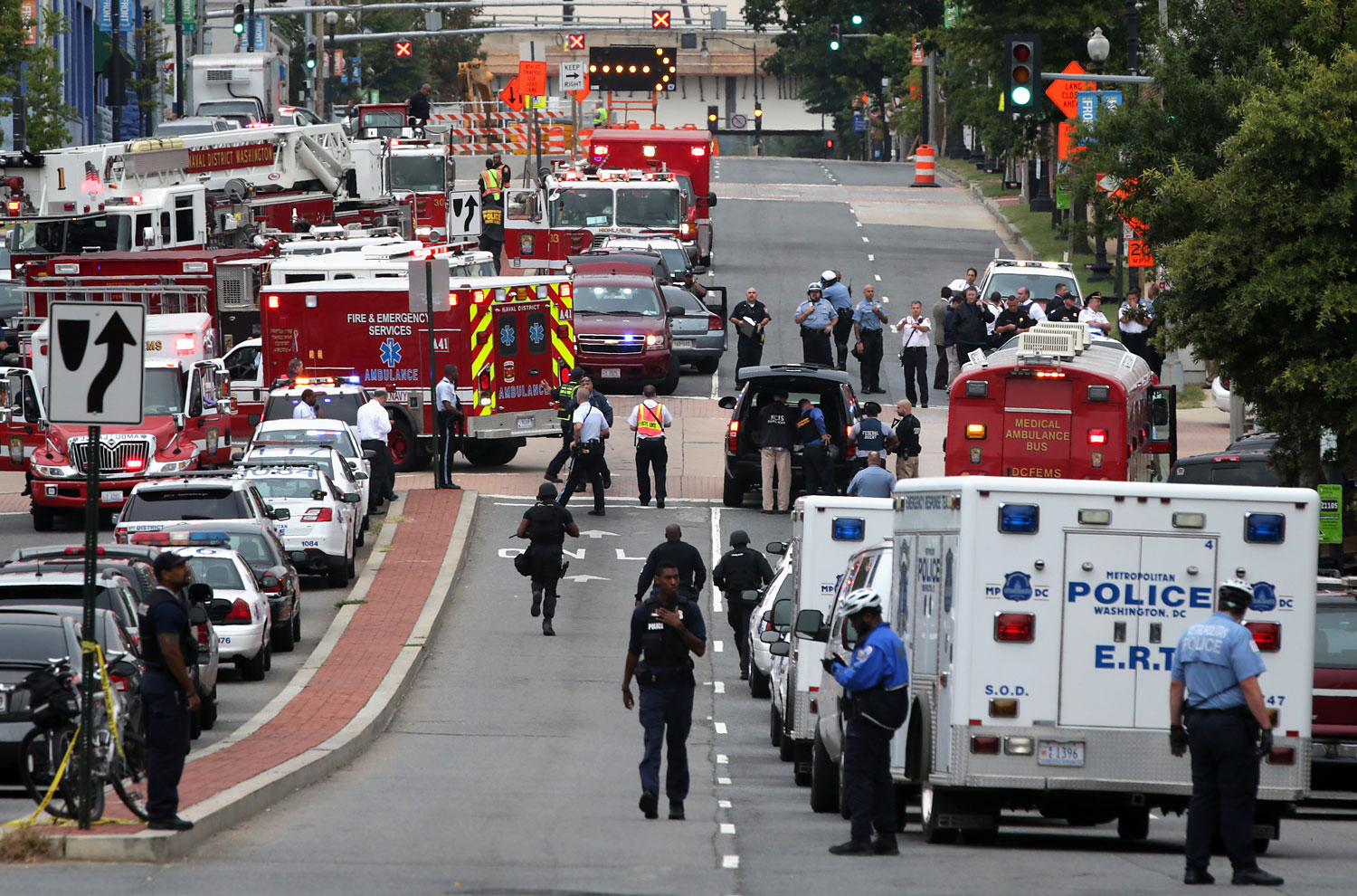 Emergency vehicles and law enforcement personnel respond to a shooting at an entrance to the Washington Navy Yard, Sept. 16, 2013 in Washington, DC. (Alex Wong—Getty Images)