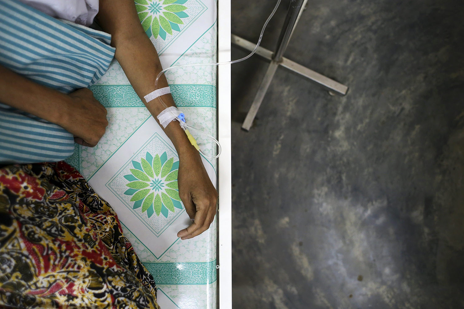 A HIV-positive patient receives medicine through an intravenous drip at Medecins Sans Frontieres Holland's clinic in Yangon