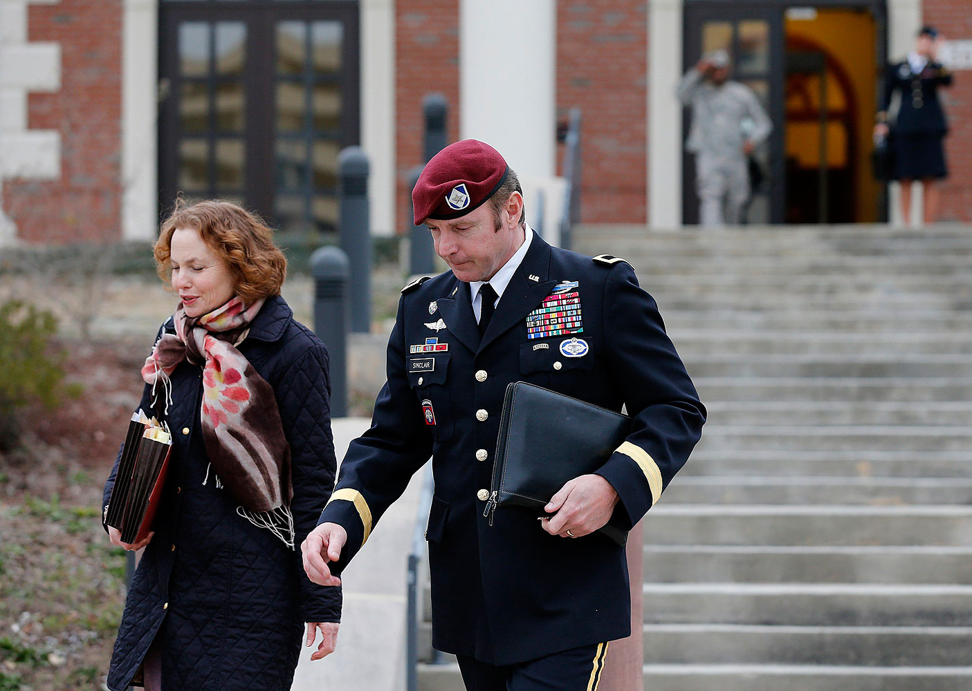 Army Brigadier General Jeffrey Sinclair leaves the courthouse with one of his attorneys at Fort Bragg in Fayetteville, N.C., on March 4, 2014.