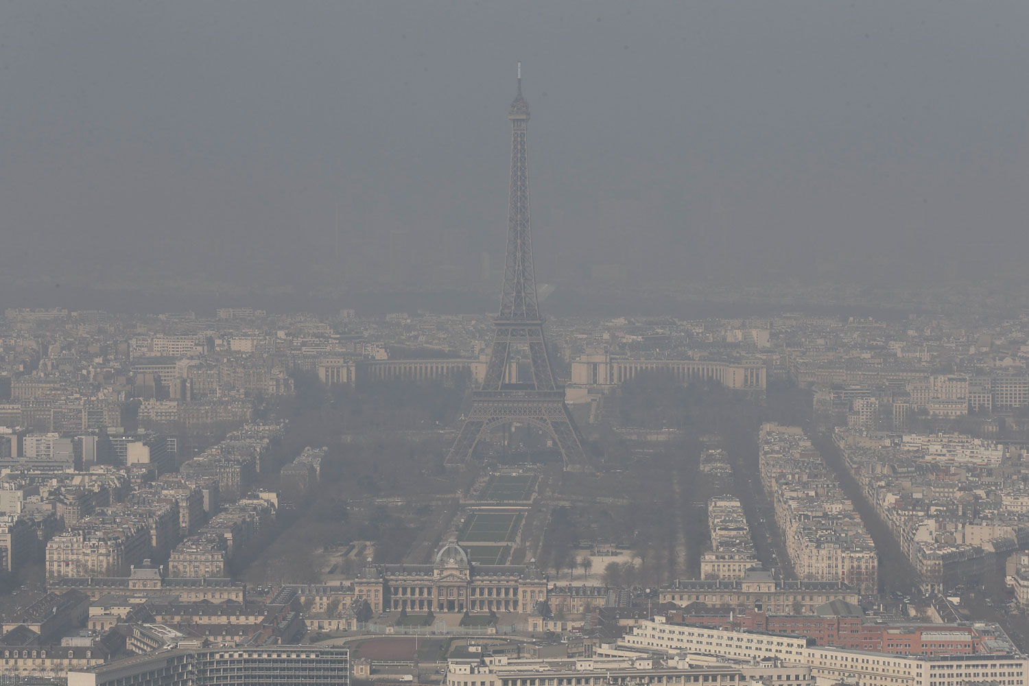 A general view shows the Eiffel tower and the Paris skyline through a small-particle haze March 13, 2014.