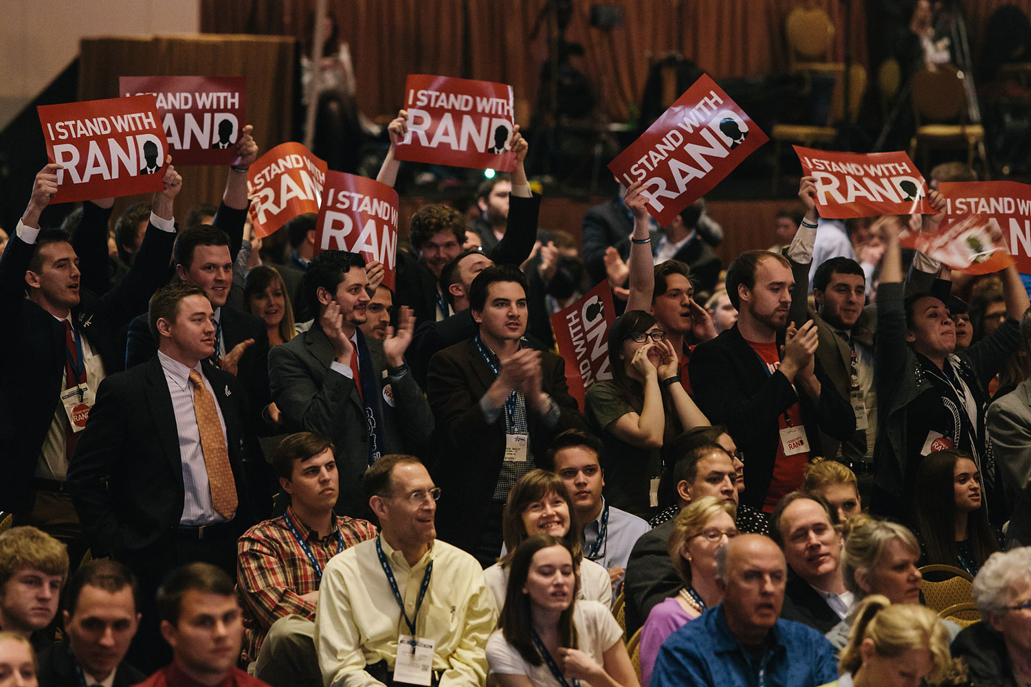 Rand Paul supporters stand and cheer when the results of a straw poll show Rand Paul winning the GOP Presidential nomination during the final day of the Conservative Political Action Conference (CPAC) at the Gaylord National Resort & Convention Center in National Harbor, Md. (Lexey Swall—GRAIN for TIME)