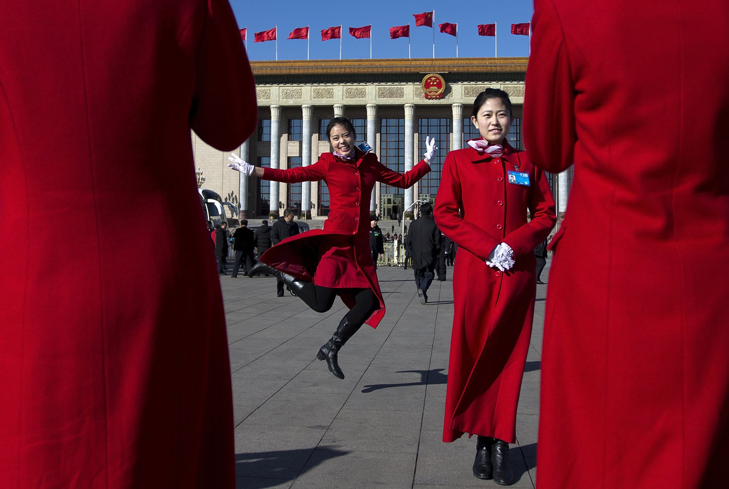 Mar. 4, 2014. Chinese hostesses, who serve the delegates of the Chinese People's Political Consultative Conference and National People's Congress, have souvenir photos taken in front of the Great Hall of the People during sessions in Beijing, China.