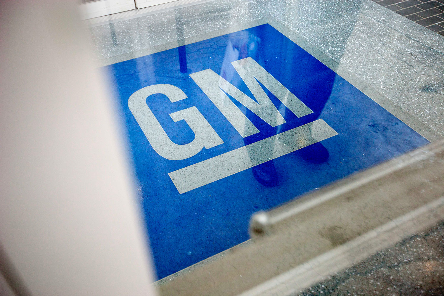 The logo for General Motors at the entrance at the site of a GM information technology center in Roswell, Ga., on Jan. 10, 2013.