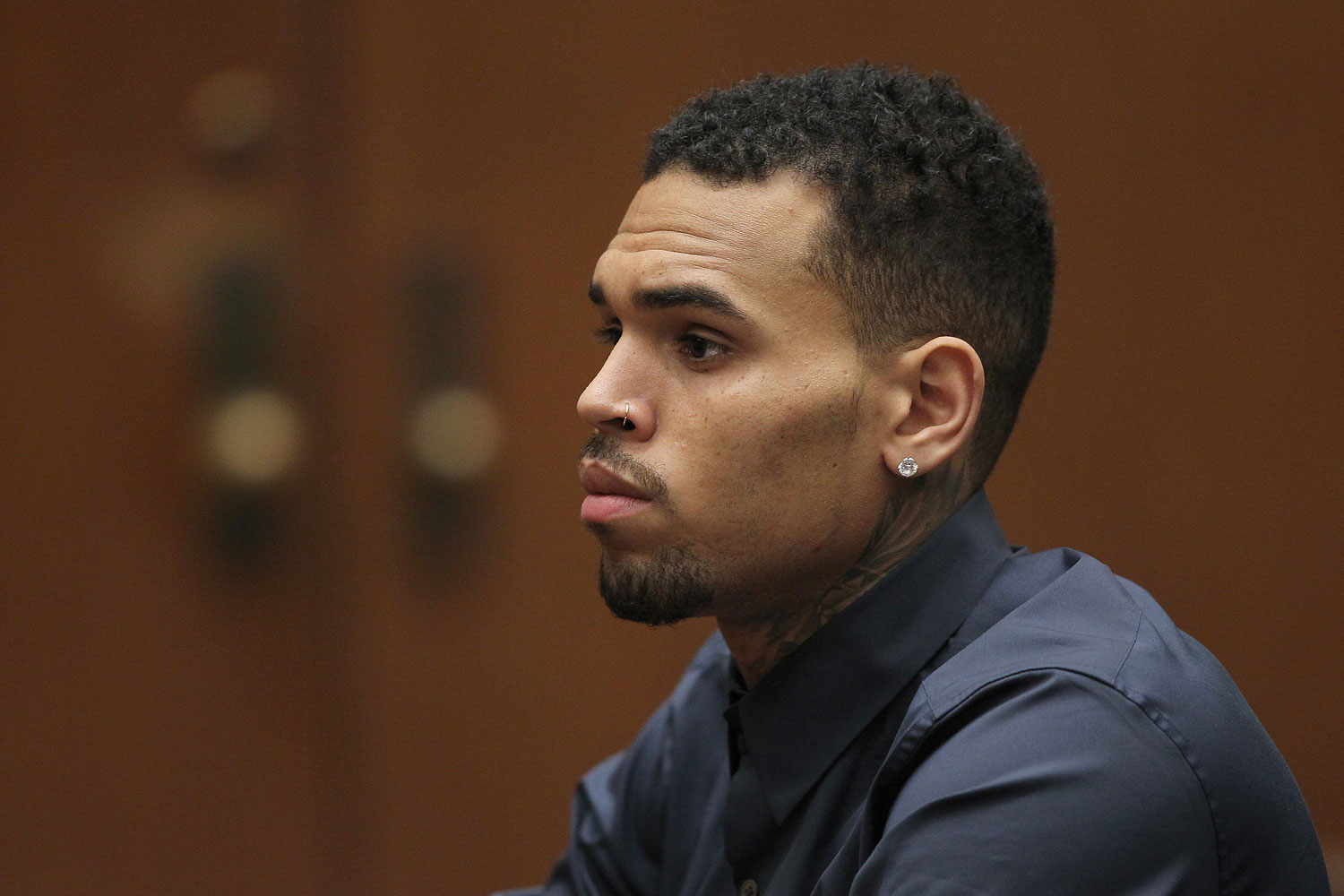 In this file photo, R&amp;B singer Chris Brown appears in court for a probation progress hearing on Feb. 3, 2014 in Los Angeles. The singer was arrested for allegedly violating his probation on March 14, 2014 in Malibu. (David McNew—Getty Images)