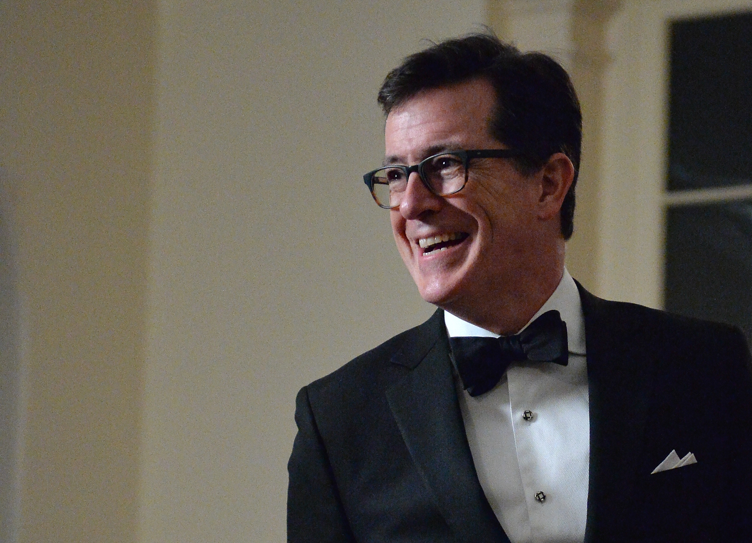 Stephen Colbert arrives at the White House in Washington on Feb. 11, 2014 for the state dinner in honor of French President Francois Hollande. (Nicholas Kamm—AFP/Getty Images)