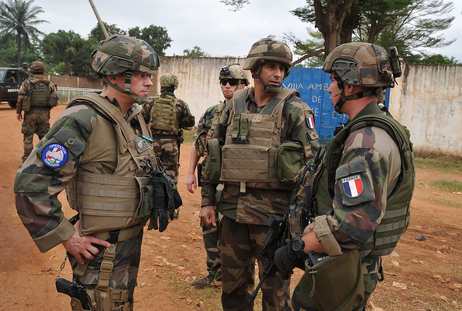 The commander of the French Sangaris operation in Central Africa Francisco Soriano (C) speaks with two soldier in the PK4 district of Bangui on February 27, 2014. The EU has announced that its proposed contingent of troops will soon join African Union and French troops currently deployed in the country. (Sia Kambou—AFP/Getty Images)