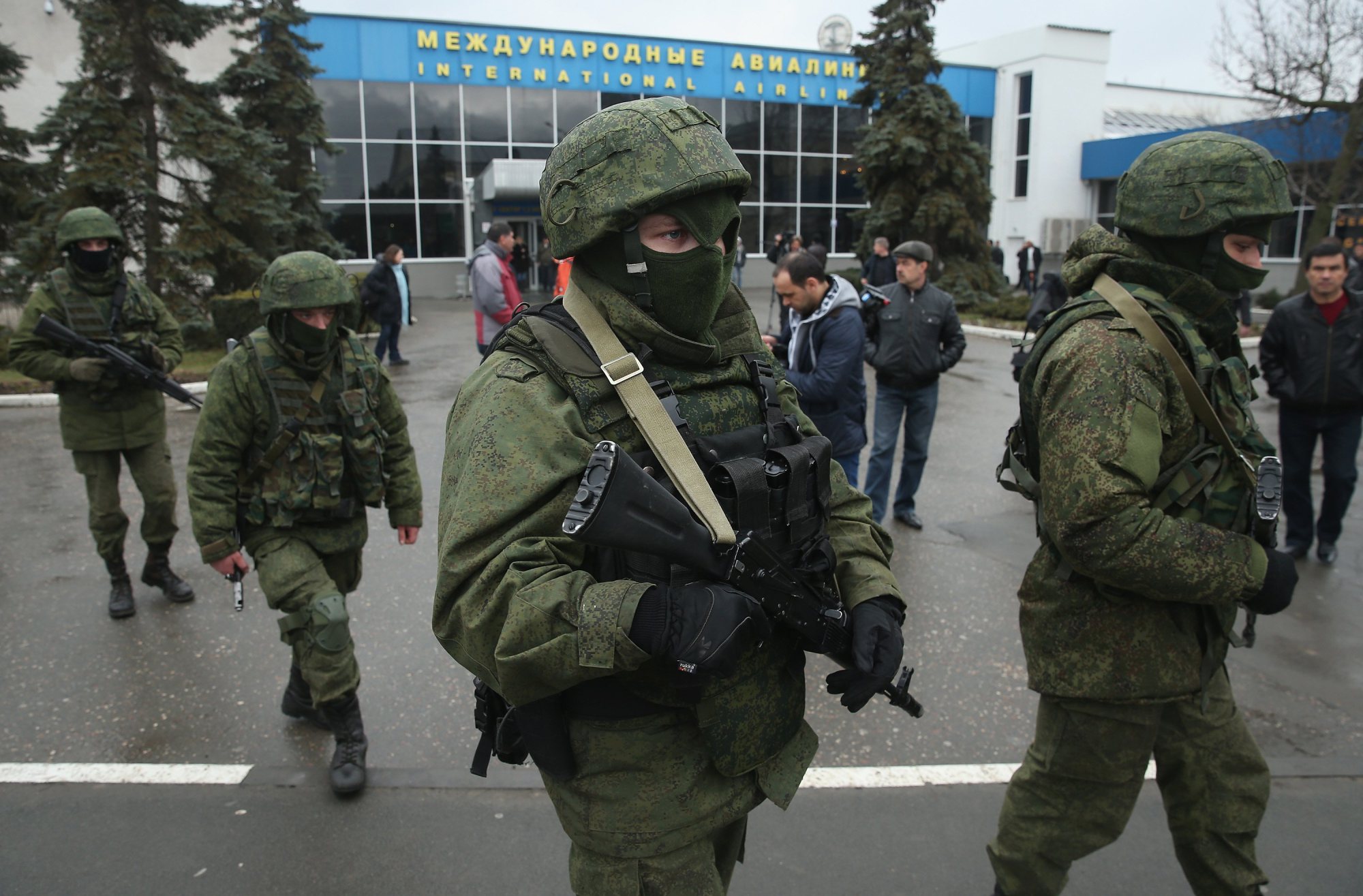 Soldiers, who were wearing no identifying insignia and declined to say whether they were Russian or Ukrainian, patrol outside the Simferopol International Airport after a pro-Russian crowd had gathered on Feb. 28, 2014.