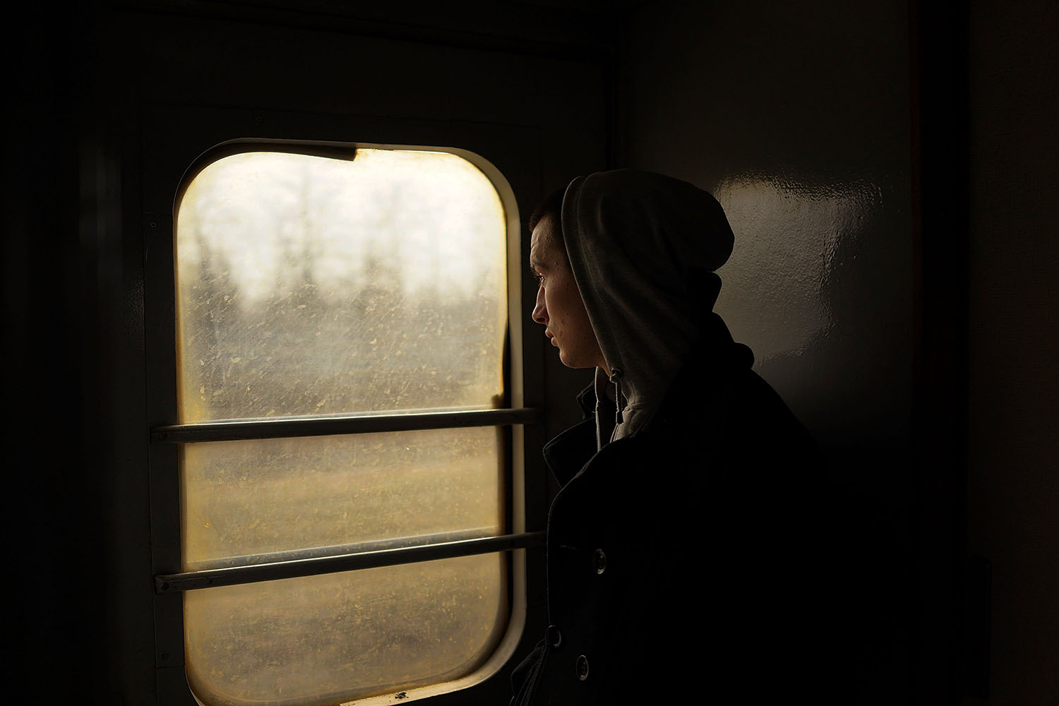Mar. 4, 2014. A Ukrainian teen looks out at the countryside from a train on the outskirts of the Crimean city of Simferopol.